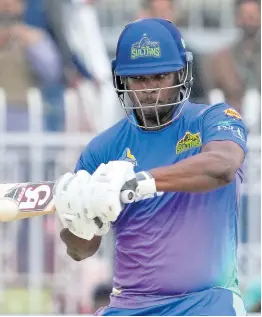  ?? AP ?? Multan Sultans’ Johnson Charles plays a shot during the Pakistan Super League T20 cricket match between Islamabad United and Multan Sultans, in Rawalpindi, Pakistan, yesterday.