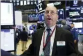  ?? RICHARD DREW — THE ASSOCIATED PRESS ?? Trader Gordon Charlop works on the floor of the New York Stock Exchange, Tuesday. The major U.S. stock indexes finished mostly higher Tuesday as investors welcomed strong corporate earnings reports from Google parent Alphabet and other companies.