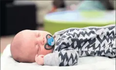  ??  ?? Sleep time: Seven-week-old Samuel Whatman was so relaxed he fell asleep.