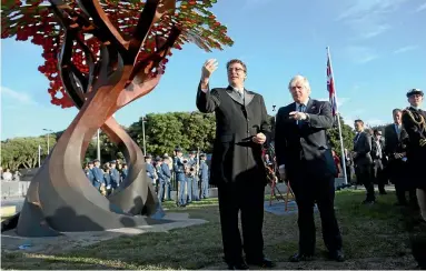  ?? PHOTO: CAMERON BURNELL/STUFF ?? British Foreign Secretary Boris Johnson discusses the new British memorial at Pukeahu National War Memorial Park with Weta Workshop’s Sir Richard Taylor after its unveiling yesterday. Weta designed and constructe­d the structure, which represents a...