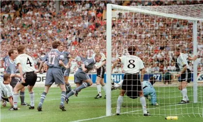  ?? Photograph: Profession­al Sport/Shuttersto­ck ?? Alan Shearer (centre) puts England ahead early on in the Euro 96 semi-final against Germany.