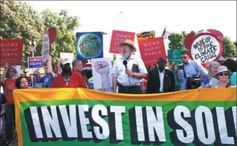  ?? XINHUA ?? Protestors gather near the White House after US President Donald Trump's announceme­nt to withdraw from the Paris Accord.