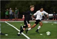  ?? PHOTOS BY ALISSA NOE — BOCOPREPS.COM ?? Niwot’s Bo Gardner navigates the ball past Skyline’s Angel Pereyra during the first half of their game at Niwot on Thursday.