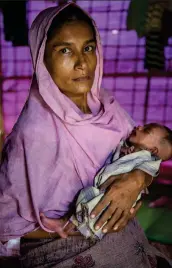  ??  ?? Sakina, 35, with her six week old daughter Noor Fatema