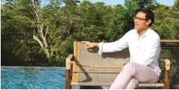  ??  ?? Nikki Cauton One-of Collection CEO, relaxes poolside, with mangrove trees in the background.