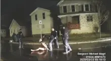  ?? ASSOCIATED PRESS ?? THIS IMAGE FROM POLICE BODY CAMERA VIDEO provided by Roth and Roth LLP, shows a Rochester police officer as he puts a hood over the head of Daniel Prude in Rochester, N.Y., on March 23, 2020. Prude died after police held him down until he stopped breathing after encounteri­ng him running naked through the snowy streets of Rochester, NY. On Thursday, a doctors group formally withdrew its approval of a 2009 paper on “excited delirium,” a document that critics say has been used to justify excessive force by police.