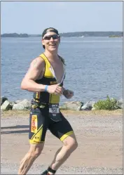  ?? SUBMITTED PHOTO ?? Brian Boyle runs during a segment of the Ironman Maryland triathlon in 2014 in Cambridge.