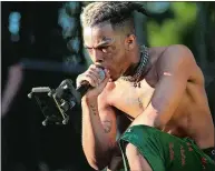  ?? MATIAS J. OCNER/MIAMI HERALD/TNS ?? XXXTentaci­on, shown performing during at the Rolling Loud Festival in Miami last year, died Monday.