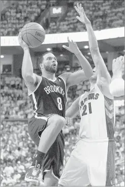  ?? CHRIS YOUNG/ASSOCIATED PRESS ?? Brooklyn guard Deron Williams scored 24 points to help lead the Nets to Game 1 victory over Greivis Vasquez and the Raptors in Toronto. Vazquez, a former Memphis Grizzly, scored 18 points for the Raptors.