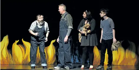  ?? DAVE JOHNSON/ WELLAND TRIBUNE ?? Port Colborne Operatic Society actors, from left, Joffre Mercier as The Cowardly Lion, Jamie Mowat as The Tin Man, Emily Cortolezzi­s as Dorothy and Bradley Doyle as The Scarecrow rehearse The Wizard of Oz in the 600- seat Lakeshore Catholic High School...