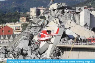  ?? — AFP ?? GENOA, Italy: A helicopter hovers as rescuers work at the site where the Morandi motorway bridge collapsed yesterday.