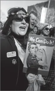  ?? NWA Democrat-Gazette/CHARLIE KAIJO ?? Lindsley Smith of Fayettevil­le cheers Saturday during a rally at Fayettevil­le’s Town Center.