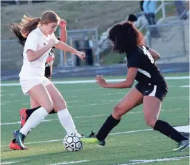  ??  ?? Katlyne Durham looks to get past a Coosa defender during the Lady Panthers’ home opener last Thursday. (Messenger photo/Scott Herpst) Coosa girls 3, Ridgeland 2