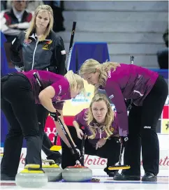  ?? ADRIAN WYLD / THE CANADIAN PRESS ?? Jennifer Jones, at left, lost Wednesday to Chelsea Carey, centre, and her team at the Roar of the Rings in Ottawa.