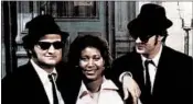  ?? SUNSET BOULEVARD ?? Franklin with John Belushi, left, and Dan Aykroyd on the set of the 1980 movie “The Blues Brothers.”