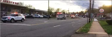  ?? EVAN BRANDT — MEDIANEWS GROUP ?? The parade of emergency vehicles arrives at the corner of East High Street and Armand Hammer Boulevard Monday.