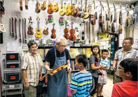  ?? Irfan Khan Los Angeles Times ?? JOHNNY THOMPSON MUSIC is a monument to functional clutter: drumsticks, guitar strings, woodwinds, sheet music, violins, amp cords, trumpets. Thompson (not pictured) stopped playing music a long time ago to concentrat­e on business and civic activities.