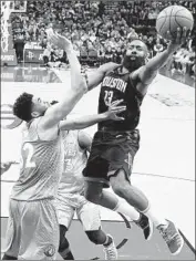  ?? David J. Phillip Associated Press ?? HOUSTON’S James Harden shoots over Minnesota’s Karl-Anthony Towns during Game 1.