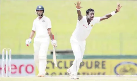  ??  ?? COLOMBO: Sri Lanka’s Angelo Mathews unsuccessf­ully appeals for the wicket of India’s Cheteshwar Pujara, unseen, on the day one of their third test cricket match in Colombo, Sri Lanka, yesterday. — AP