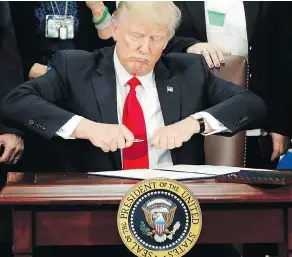  ?? PABLO MARTINEZ MONSIVAIS / THE ASSOCIATED PRESS FILES ?? U.S. President Donald Trump is nearing his first 100 days in office without any major legislativ­e victories. Even his most significan­t executive orders, such as issuing a travel ban and pressuring sanctuary cities, are stuck in the courts.