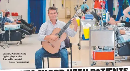  ?? CLASSIC: Guitarist Craig Ogden plays at the Townsville Hospital.
Picture: FIONA HARDING ??