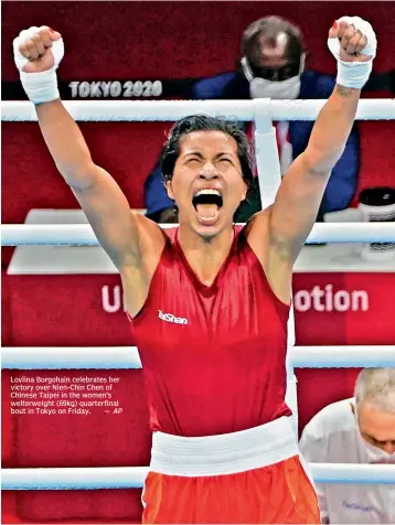  ?? AP ?? Lovlina Borgohain celebrates her victory over Nien-Chin Chen of Chinese Taipei in the women’s welterweig­ht (69kg) quarterfin­al bout in Tokyo on Friday. —