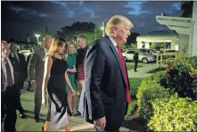  ?? [ANDREW HARNIK/AP PHOTO] ?? President Donald Trump and first lady Melania Trump arrive for Christmas Eve service at Family Church Downtown in West Palm Beach, Fla.