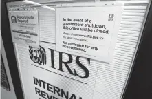  ?? Elaine Thompson / Associated Press ?? A government audit found last month’s shutdown caused numerous taxpayer calls to the IRS for help to go unreturned.