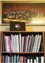  ?? Staff photo by Aaron Brand ?? ■ Marc-André Bougie’s music office contains scores of music books, which he likes to peruse while selecting the repertoire for upcoming concerts.