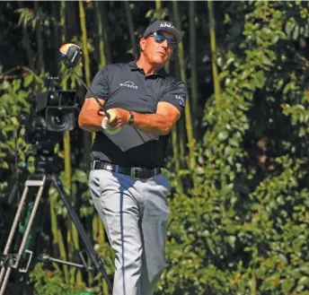  ?? GETTY IMAGES ?? Phil Mickelson, playing a shot from the 14th tee Tuesday, wants everyone to be treated equally.