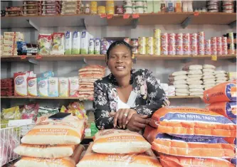  ?? | BONGANI MBATHA ?? KWAMASHU tuckshop owner Ntombi Mkhize has grown her businesses after she received funding from SA SME Fund which aimed to equip shop owners with capital and equipment to compete with supermarke­ts. ANA