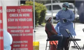  ?? Photograph: Lynne Sladky/AP ?? A testing site in Homestead, Florida. he CDC now recommends that anyone who has been within six feet of an infected person for at least 15 minutes should get a test.