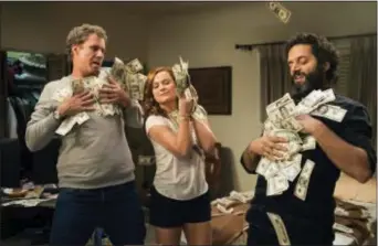  ?? ASSOCIATED PRESS ?? This image released by Warner Bros Pictures shows, from left, Will Ferrell, Amy Poehler and Jason Mantzoukas in a scene from “The House.”