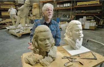  ?? AMY DAVIS/BALTIMORE SUN PHOTOS ?? Sculptor Steven Weitzman in his Brentwood studio with two versions of the head of civil rights activist Barbara Rose Johns, which will eventually be made into a full figure, cast in bronze.