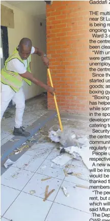  ?? ?? Ward 3 councillor Ntokozo Mlungwana cleaning up the mess