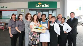  ??  ?? Pictured above: Celebrity chef Catherine Fulvio and Sligo participan­t Bernice Ann Beukes who is originally from South Africa with staff of the Londis supermarke­t in Grange, North Sligo.