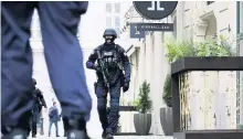  ??  ?? An armed police officer patrols the streets in Vienna, Austria