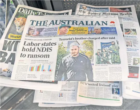  ?? AFP ?? Morning newspapers sit on display at a news kiosk in Sydney on May 17, 2017.