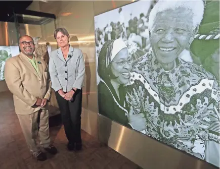  ?? MIKE DE SISTI/MILWAUKEE JOURNAL SENTINEL ?? Robert Davis and Ellen Censky, presidents of America’s Black Holocaust Museum and the Milwaukee Public Museum, respective­ly, stand at the public museum’s Nelson Mandela exhibit on Wednesday. The two museums have partnered to bring the Mandela exhibit to Milwaukee.