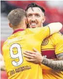  ??  ?? Well pleased Ryan Bowman celebrates his goal with Louis Moult