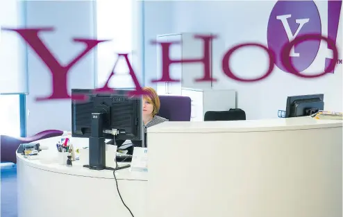  ?? DAVID RAMOS / BLOOMBERG ?? Yahoo will take a US$350-million hit in its sale price to Verizon Communicat­ions, a revised agreement indicates.