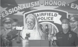  ?? MARKMIRKO/HARTFORD COURANT ?? Fairfield First Selectwoma­n Brenda Kupchick expresses concern with a police reform bill while being drowned out by shouts from Black Lives Matter demonstrat­ors in July outside the Fairfield Police Department.