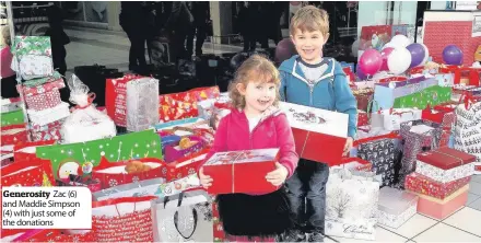  ??  ?? Generosity Zac (6) and Maddie Simpson (4) with just some of the donations