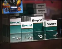  ?? Tribune News Service/getty Images ?? Packs of Newport cigarettes are seen on a shelf in a grocery store in the Flatbush neighborho­od on April 29, 2021, in the Brooklyn borough of New York City.