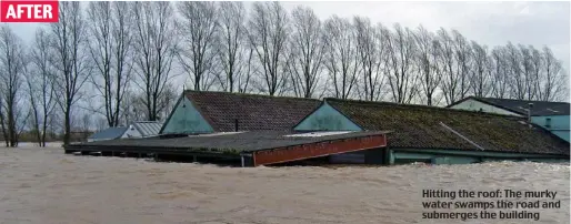  ??  ?? Hitting the roof: The murky water swamps the road and submerges the building