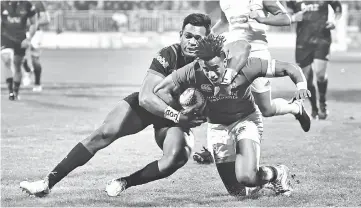  ?? — AFP photo ?? Lions’ Anthony Watson is tackled by Crusaders’ Seta Tamanivalu during the rugby union match between the Crusaders and the British and Irish Lions at AMI Stadium in Christchur­ch.