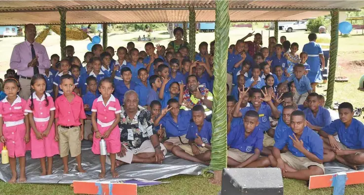  ?? ?? Minister for Lands and Mineral Resources, Filimoni Vosarogo, with school representa­tives, guests and students during the commission­ing of the Coboi Primary School borehole at Lekutu, Bua, on April 12, 2023.