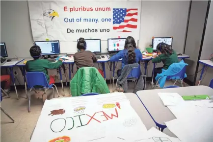  ?? COURTNEY SACCO/USA TODAY NETWORK ?? Young migrants use computers inside a classroom in U.S. Immigratio­n and Customs Enforcemen­t’s South Texas Family Residentia­l Center in Dilley, Texas.