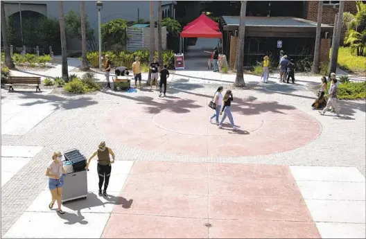  ?? ANA RAMIREZ U-T PHOTOS ?? Students began moving into the residence halls at San Diego State University on Thursday. The fall semester with in-person classes starts on Monday.