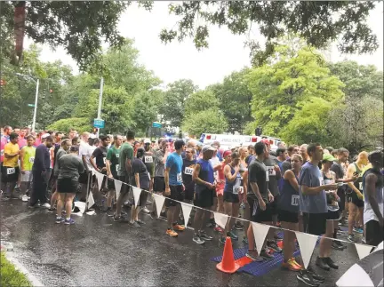  ?? Contribute­d photo ?? Over 750 runners from Connecticu­t corporatio­ns braved the elements at the 2018 CFA Society Hartford Corporate 5K on Aug. 3 in Hartford to raise a record $20,000 for local nonprofit The Connection of Middletown.